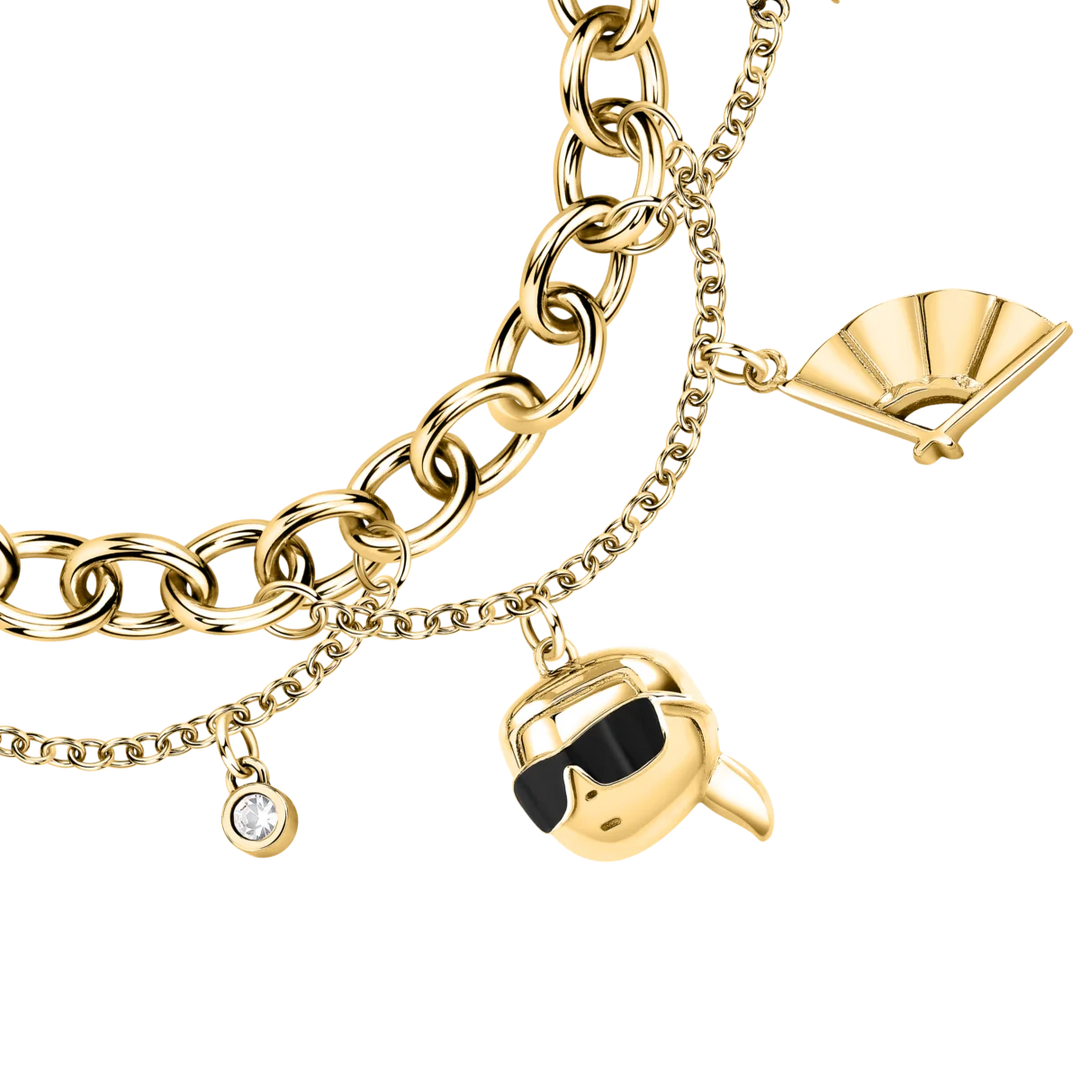 Елегантна златиста гривна Karl Lagerfeld с висулки глава с очила, ръкавица, ветрило и кристал – модел KLAYD11, детайлен близък план