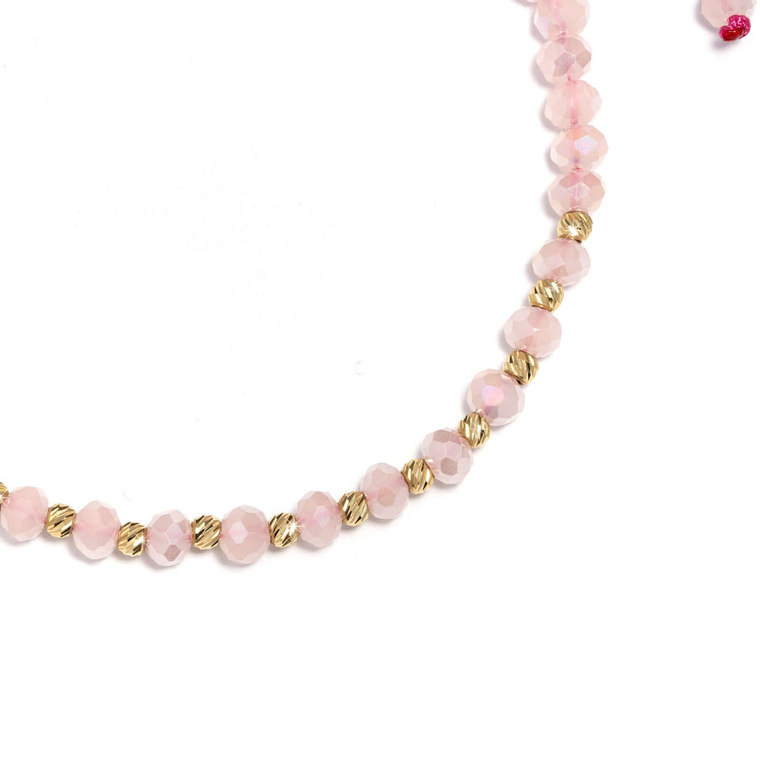 Дамска гривна с розов конец и златни елементи от злато 14к.