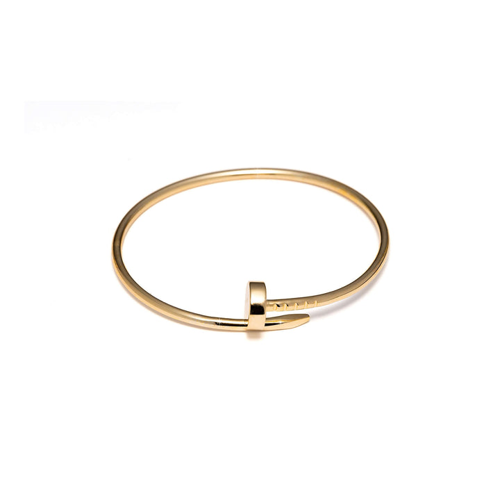 Дамска сребърна твърда гривна Пирон със златно покритие.