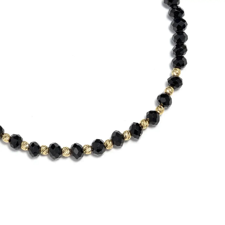 Регулируема гривна с черни мъниста и злато върху черна връзка