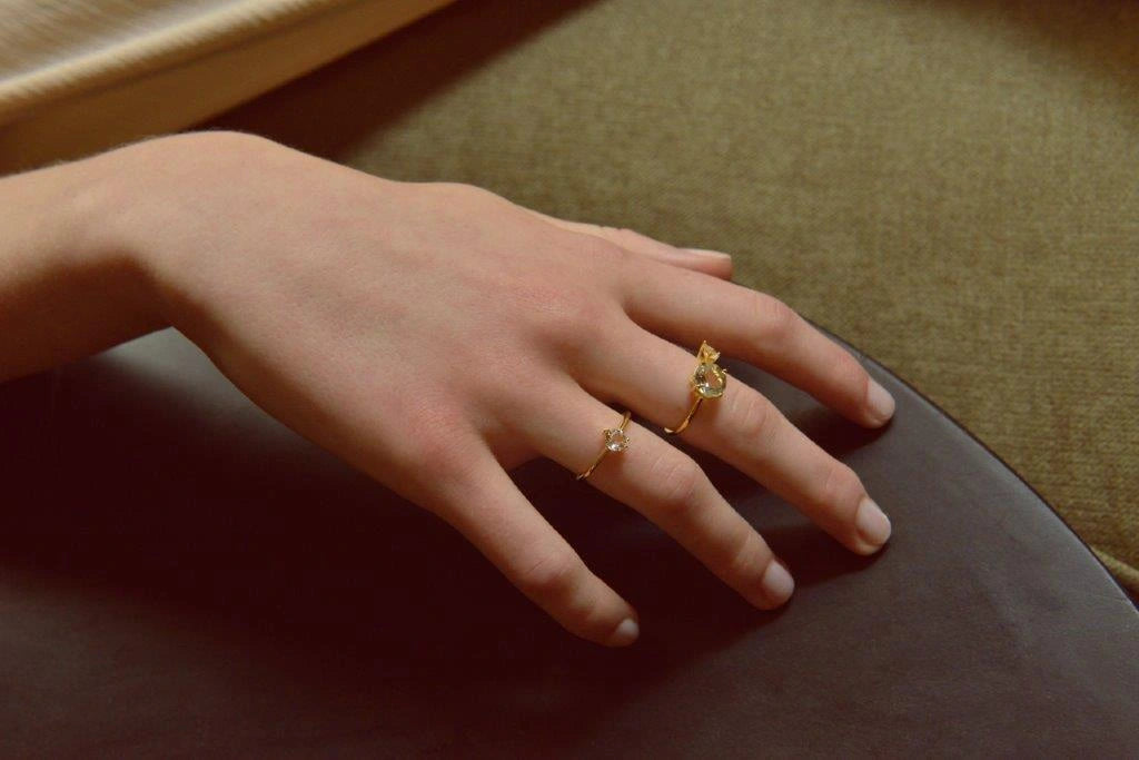 Gold-plated silver solitaire ring with white CZ Salvatore Plata — worn on a model