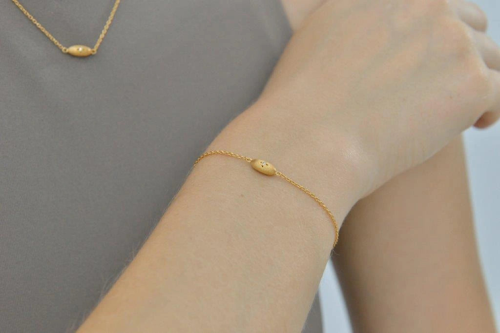 Gold-plated silver bracelet with oval star detail Salvatore Plata — worn on a model