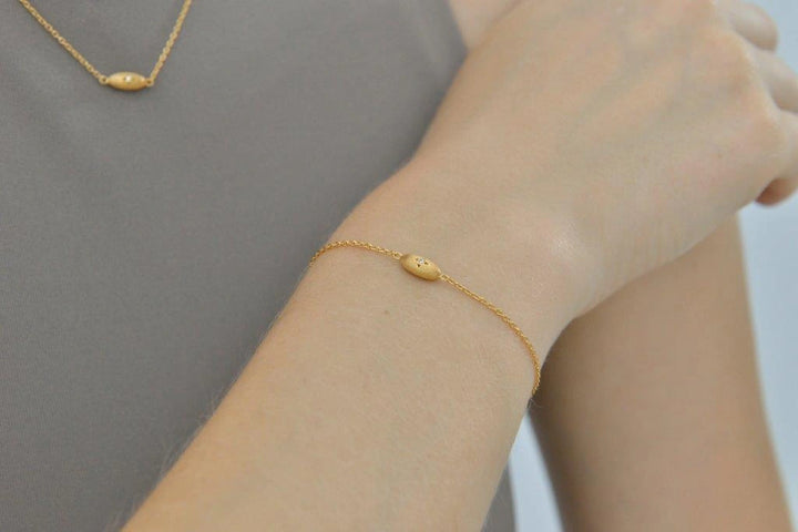 Gold-plated silver bracelet with oval star detail Salvatore Plata — worn on a model