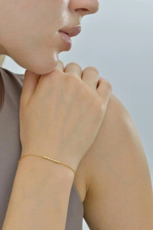 Gold-plated silver bracelet with white CZ bar Salvatore Plata — worn on a model