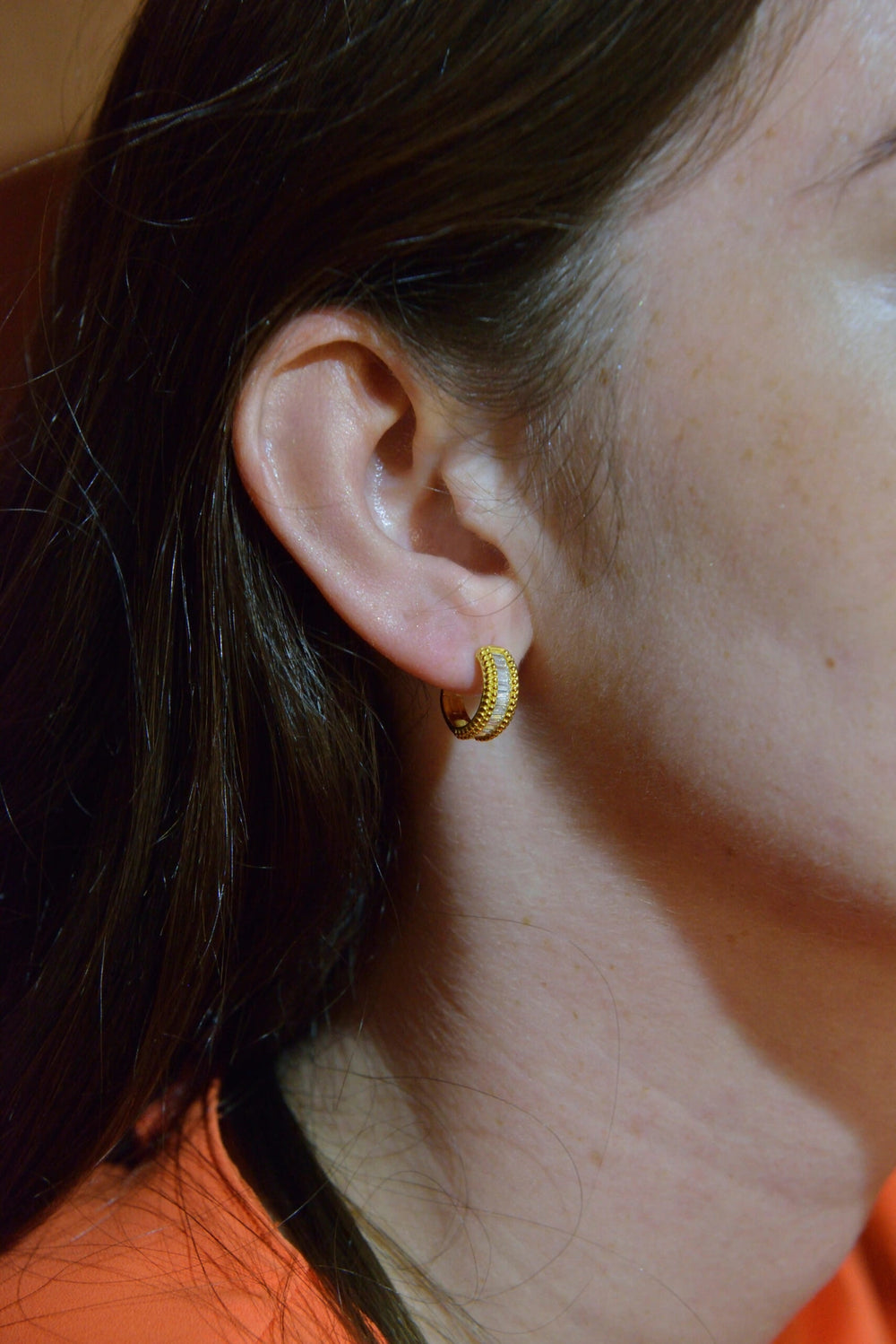 Gold-plated silver hoops with baguette CZ Salvatore Plata — worn on a model