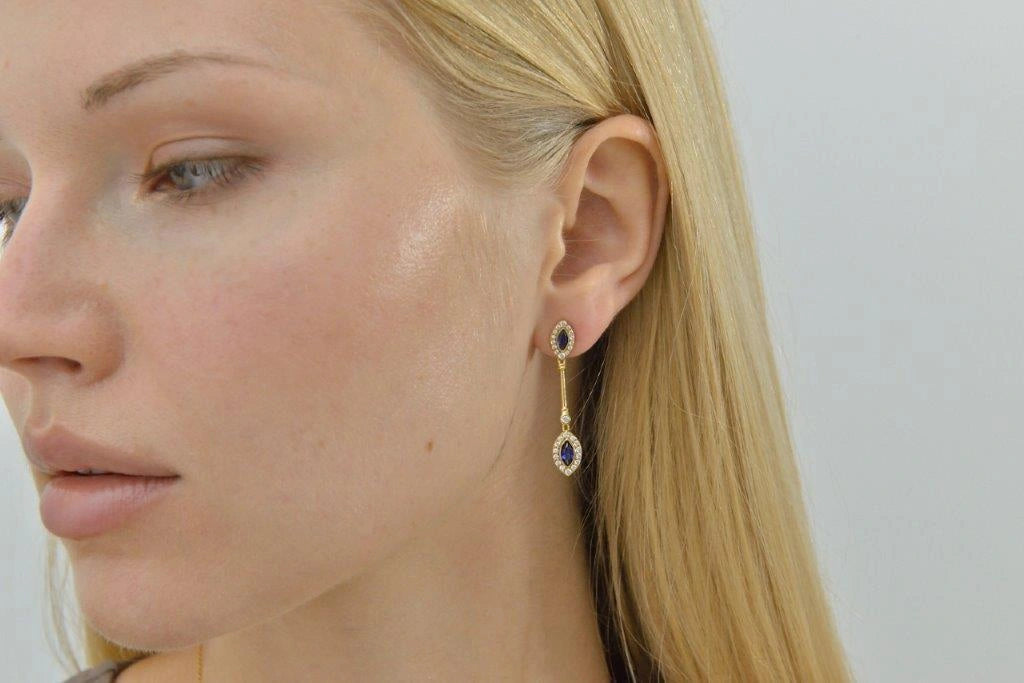 Gold-plated silver drop earrings with blue CZ Salvatore Plata 136A0827 — worn on a model
