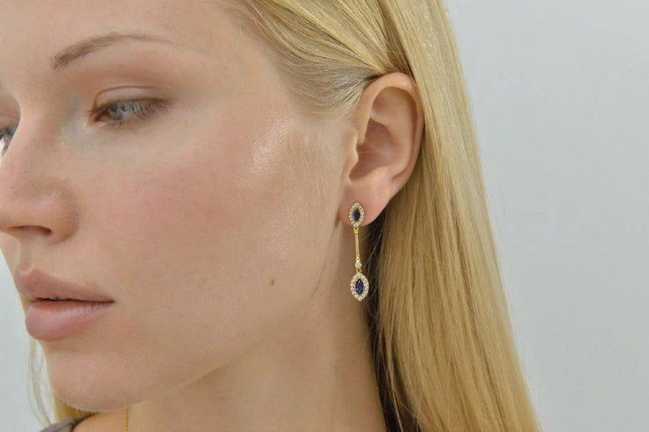 Gold-plated silver drop earrings with blue CZ Salvatore Plata 136A0827 — worn on a model