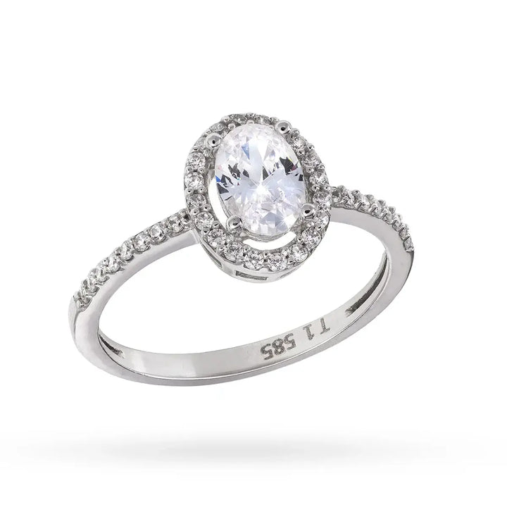 Бял златен пръстен с овален централен циркон и малки камъни