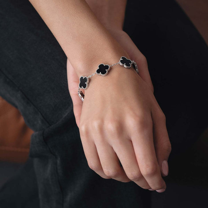 Silver bracelet with 5 clovers and black onyx