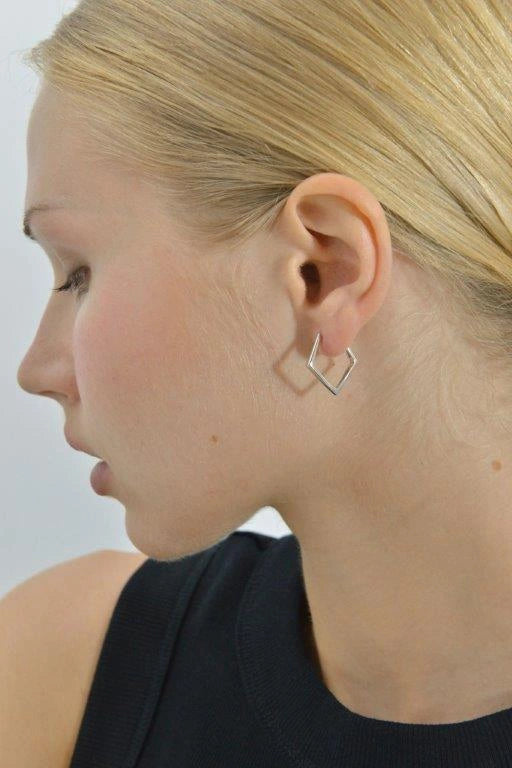 Silver geometric rhombus hoop earrings Salvatore Plata — worn on a model