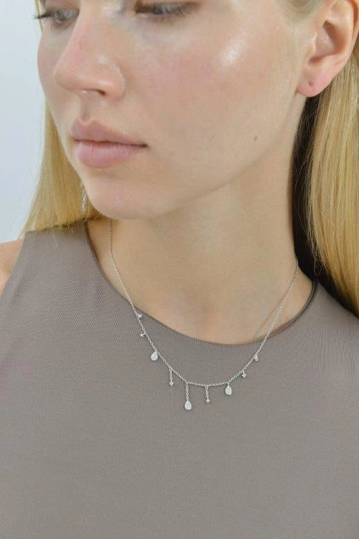 Silver necklace with pear-cut CZ and dangling accents Salvatore Plata — worn on a model