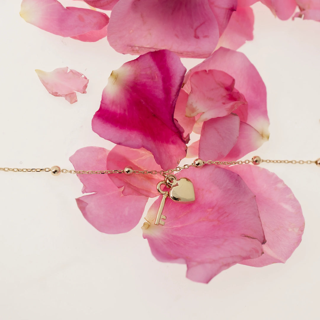 Дамска златна гривна със сърце и ключ. Senso Gold
