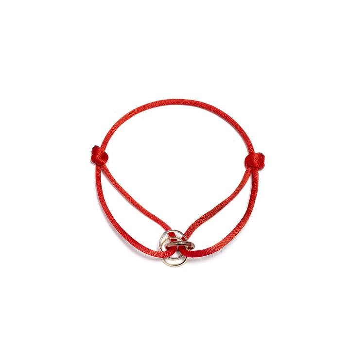 Гривна с червен конец и златни елементи в три цвята злато. Senso Gold