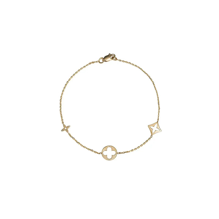 Златна дамска гривна с три флорални златни елемента