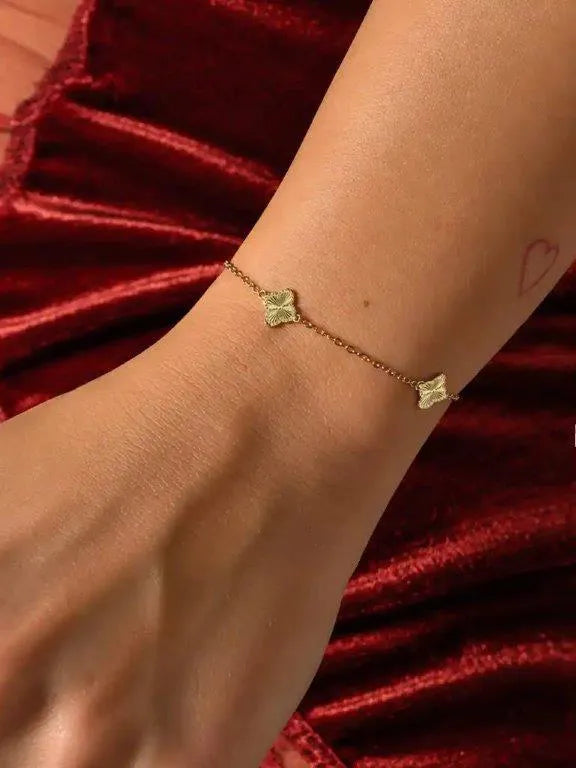 14K Gold Bracelet with Three Textured Clovers by Senso Gold, DB2670, worn on a model